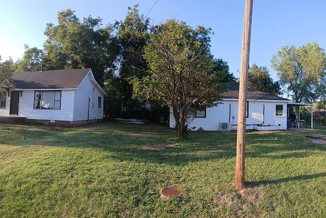 view of side of property featuring a yard