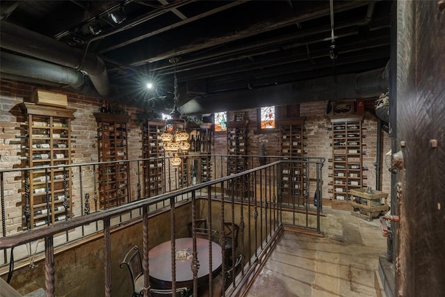 wine room featuring brick wall