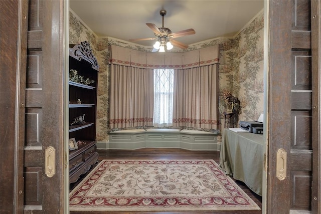 interior space with hardwood / wood-style floors, ceiling fan, and ornamental molding