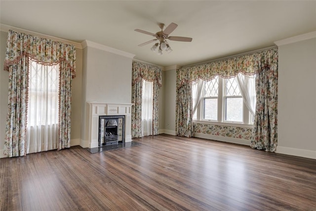 unfurnished living room with ceiling fan, ornamental molding, a healthy amount of sunlight, and hardwood / wood-style flooring