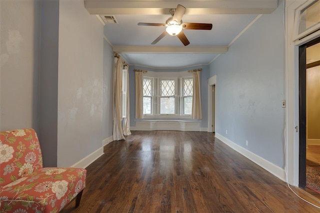 unfurnished room featuring ceiling fan, beam ceiling, dark hardwood / wood-style flooring, and crown molding