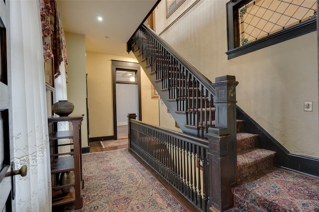 stairway with wood-type flooring