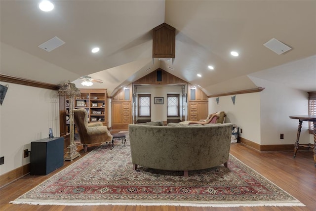 living room featuring hardwood / wood-style floors, ceiling fan, and lofted ceiling