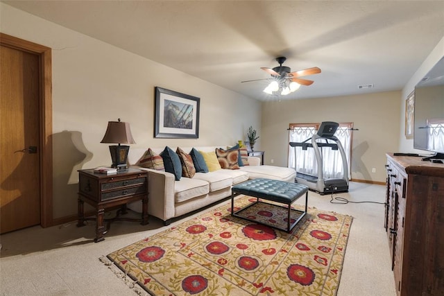 living room with ceiling fan and light carpet