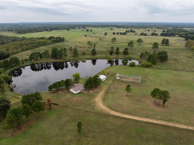 birds eye view of property featuring a water view and a rural view