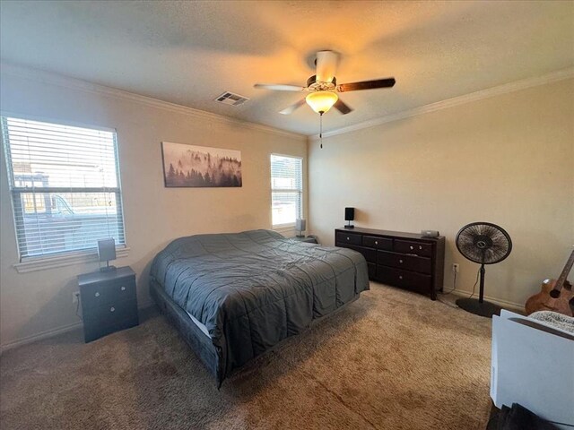 carpeted bedroom featuring multiple windows, crown molding, and ceiling fan