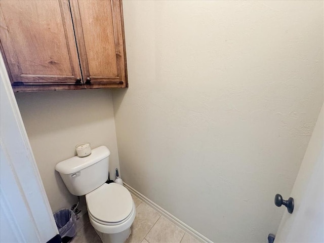 bathroom featuring tile patterned floors and toilet