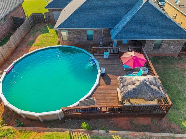 view of swimming pool featuring a wooden deck