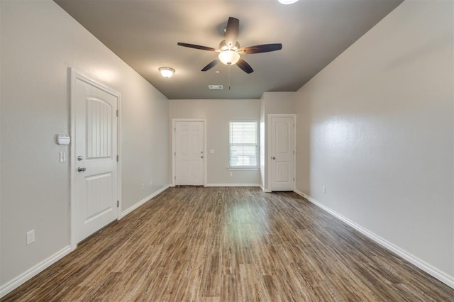 spare room with hardwood / wood-style flooring and ceiling fan