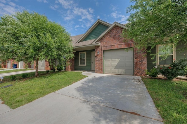 view of front of home with a front lawn and a garage