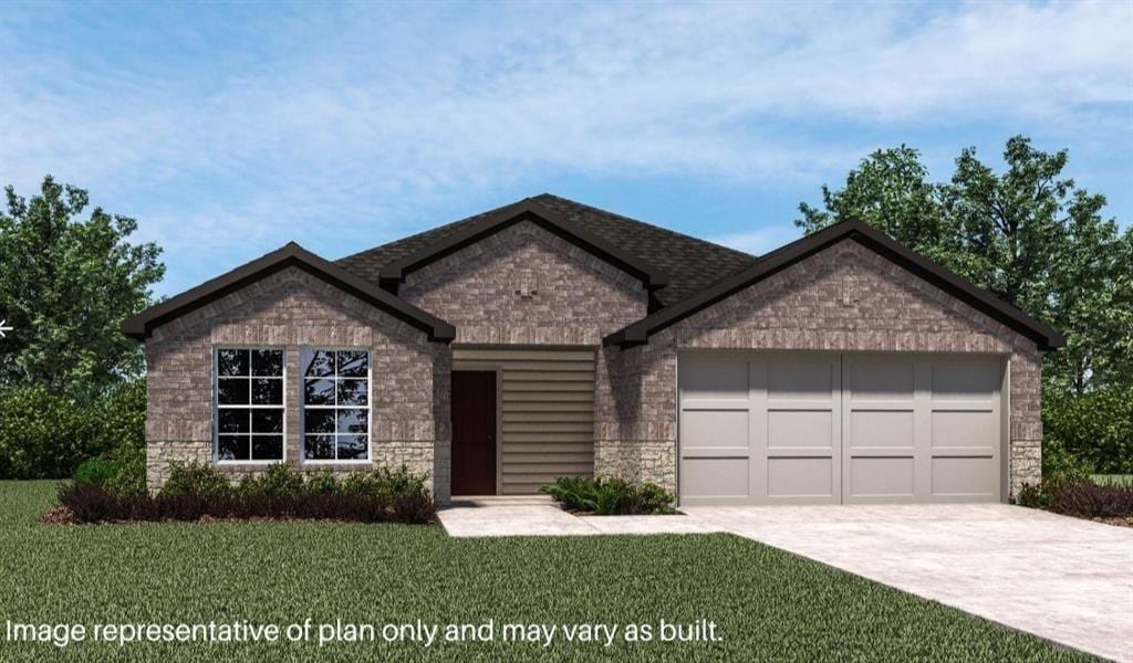 view of front of home featuring a garage and a front lawn