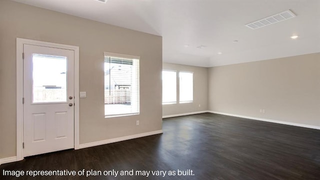 entrance foyer featuring baseboards, visible vents, and dark wood finished floors