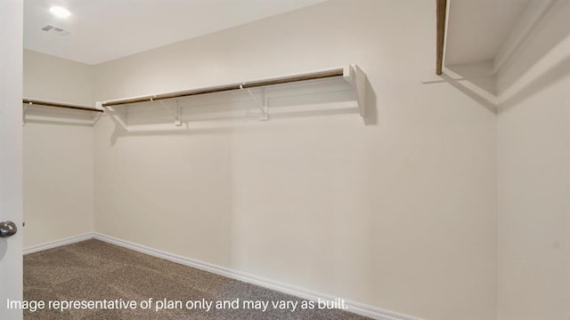 walk in closet featuring visible vents and carpet flooring