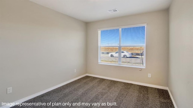 carpeted spare room with visible vents and baseboards