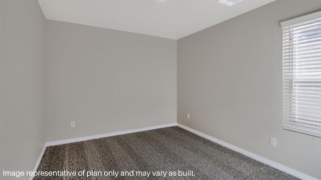 carpeted spare room with baseboards