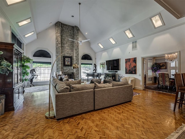 living room with light parquet floors, high vaulted ceiling, and a wealth of natural light