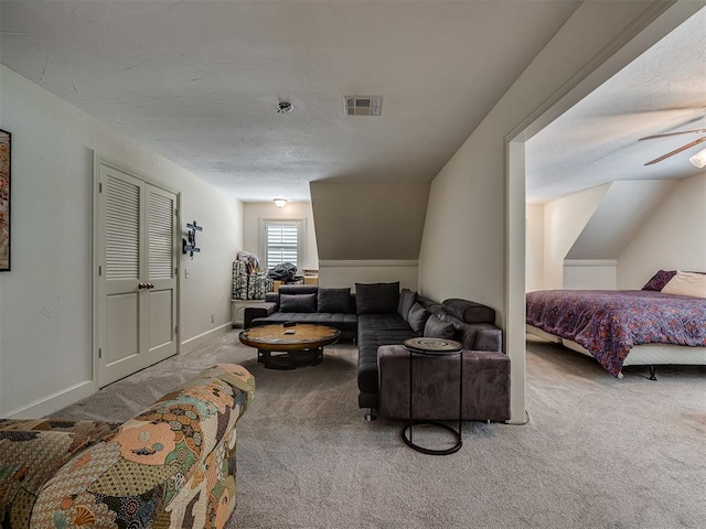 carpeted living room featuring ceiling fan