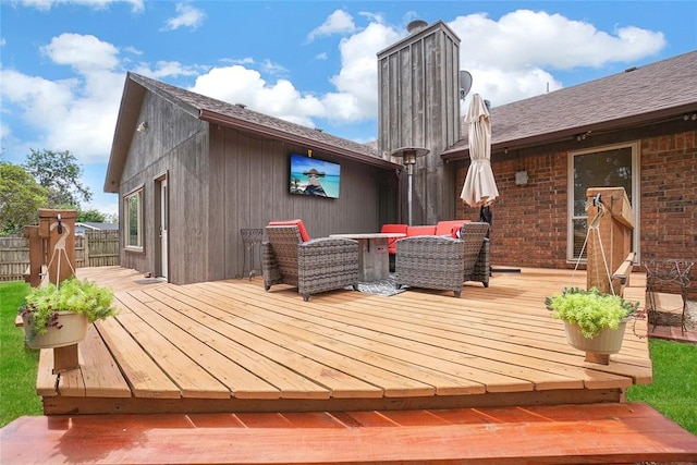 deck featuring outdoor lounge area