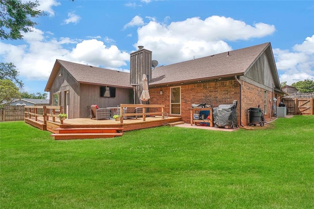 back of house featuring a lawn, cooling unit, and a deck