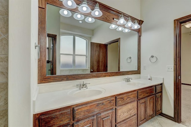 bathroom featuring tile patterned flooring and vanity