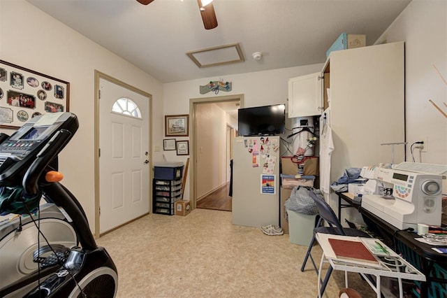 interior space with ceiling fan