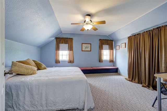 carpeted bedroom with ceiling fan and lofted ceiling