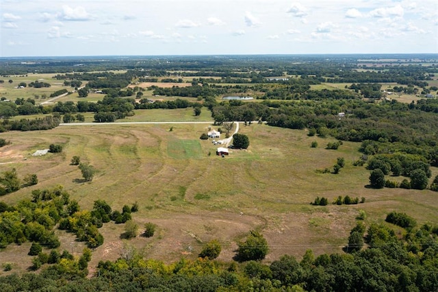 birds eye view of property featuring a rural view