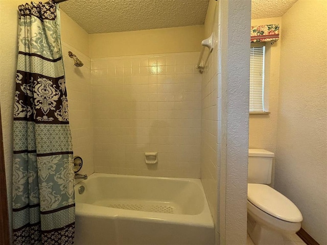 bathroom with shower / tub combo with curtain, a textured ceiling, and toilet