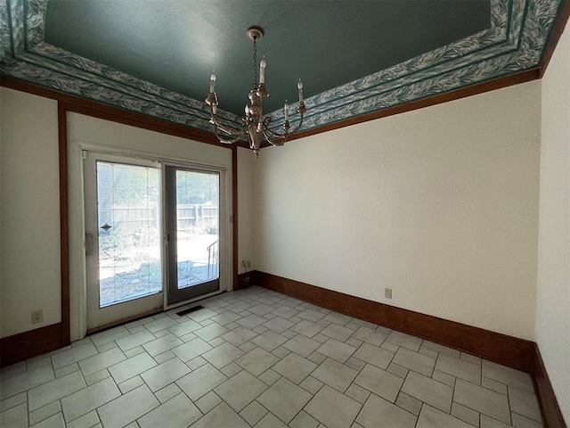 unfurnished room with an inviting chandelier