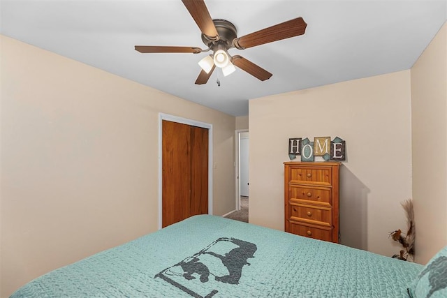 bedroom with ceiling fan and a closet