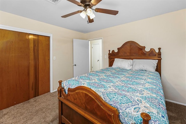 carpeted bedroom featuring a closet and ceiling fan