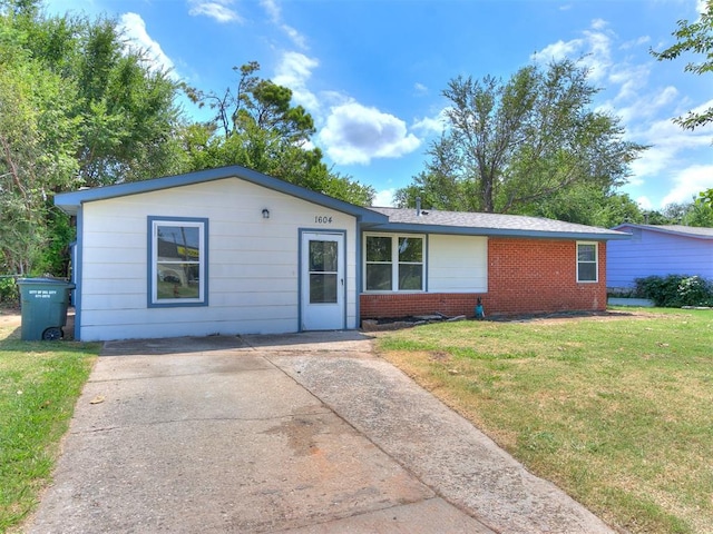 ranch-style house with a front lawn