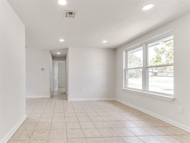 spare room with light tile patterned flooring