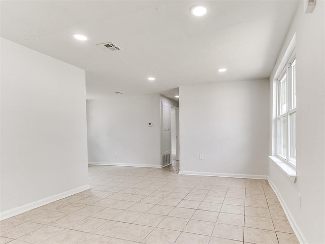 unfurnished room with light tile patterned floors