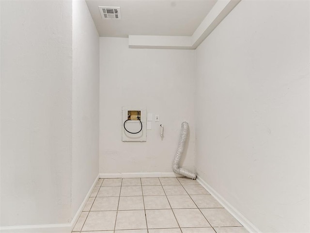 laundry area with hookup for a washing machine, light tile patterned floors, and hookup for an electric dryer