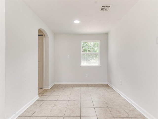 empty room with light tile patterned flooring