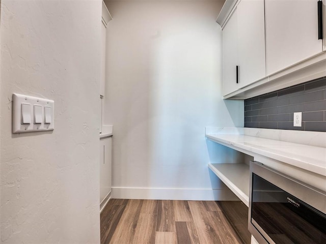 interior space featuring hardwood / wood-style flooring and wine cooler