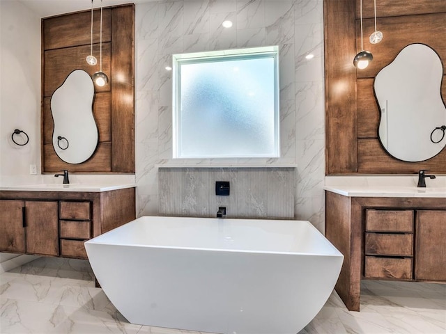 bathroom with vanity, tile walls, and a bathing tub