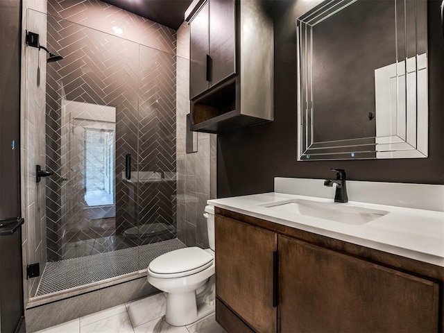 bathroom featuring walk in shower, vanity, and toilet