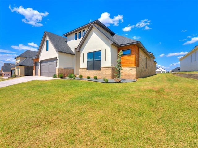 view of front of home with a front lawn and a garage