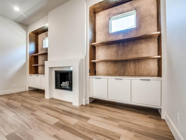 unfurnished living room featuring light hardwood / wood-style floors