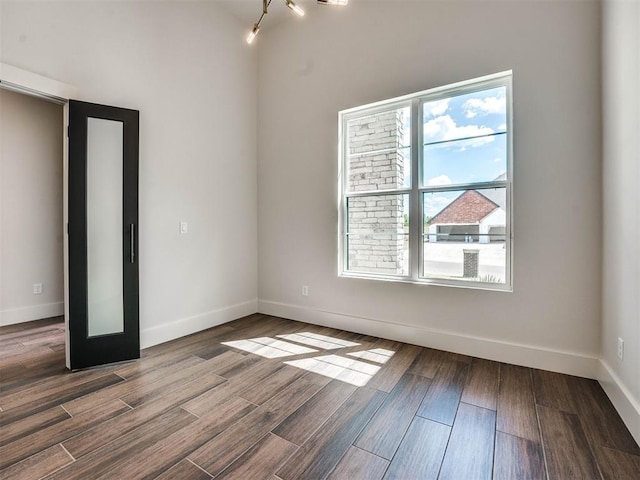 unfurnished room featuring hardwood / wood-style floors