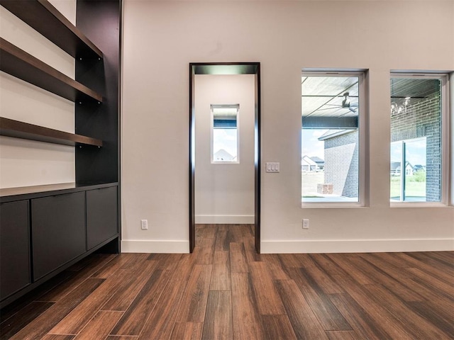 unfurnished bedroom with dark wood-type flooring