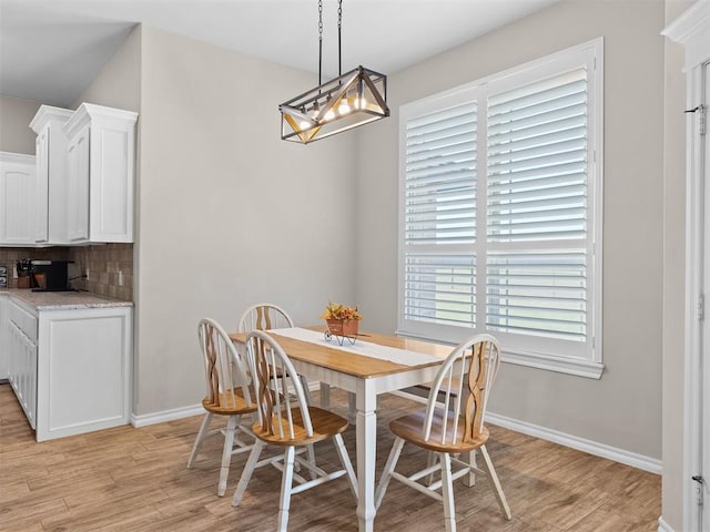 dining space with light hardwood / wood-style flooring