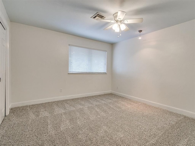 unfurnished room with carpet floors and ceiling fan