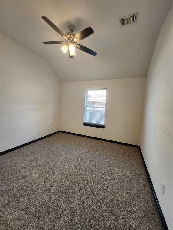 additional living space featuring carpet floors, vaulted ceiling, and ceiling fan