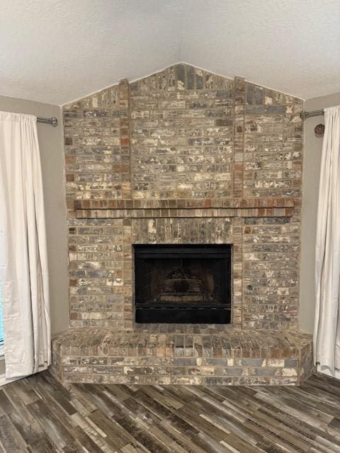 room details with hardwood / wood-style floors and a brick fireplace