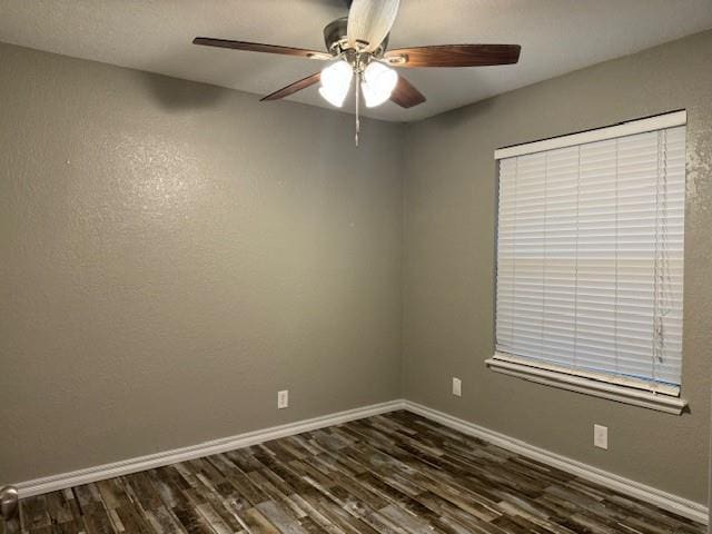 unfurnished room featuring ceiling fan and dark hardwood / wood-style flooring