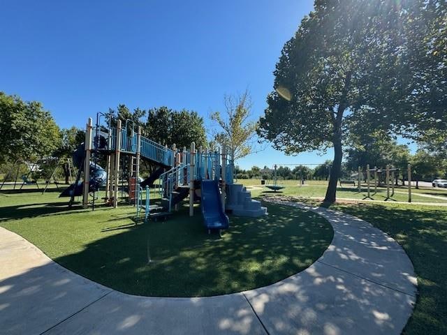 view of play area featuring a lawn