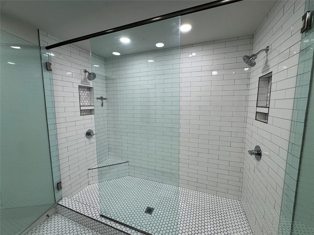 bathroom with a shower with shower door